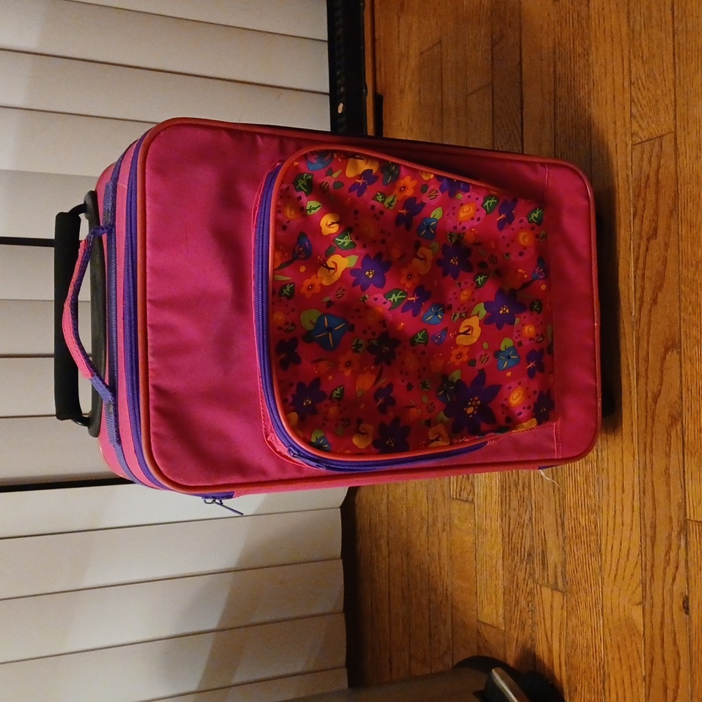 Child's rolling luggage bag 2 compartment in pink some fraying on bottom